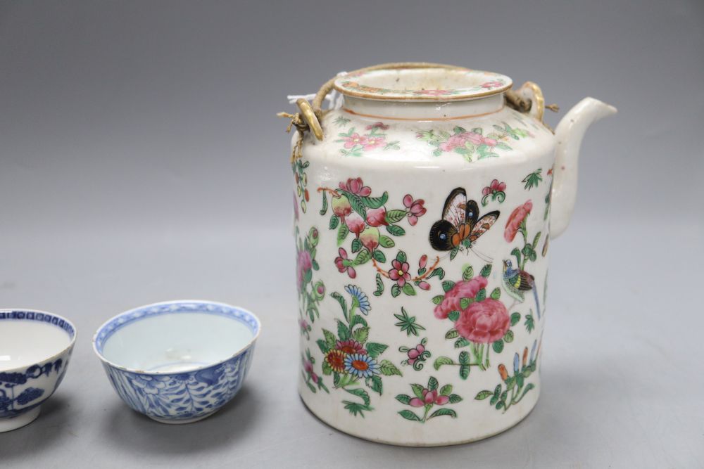 A Chinese famille rose teapot, height 15cm and two blue and white teabowls